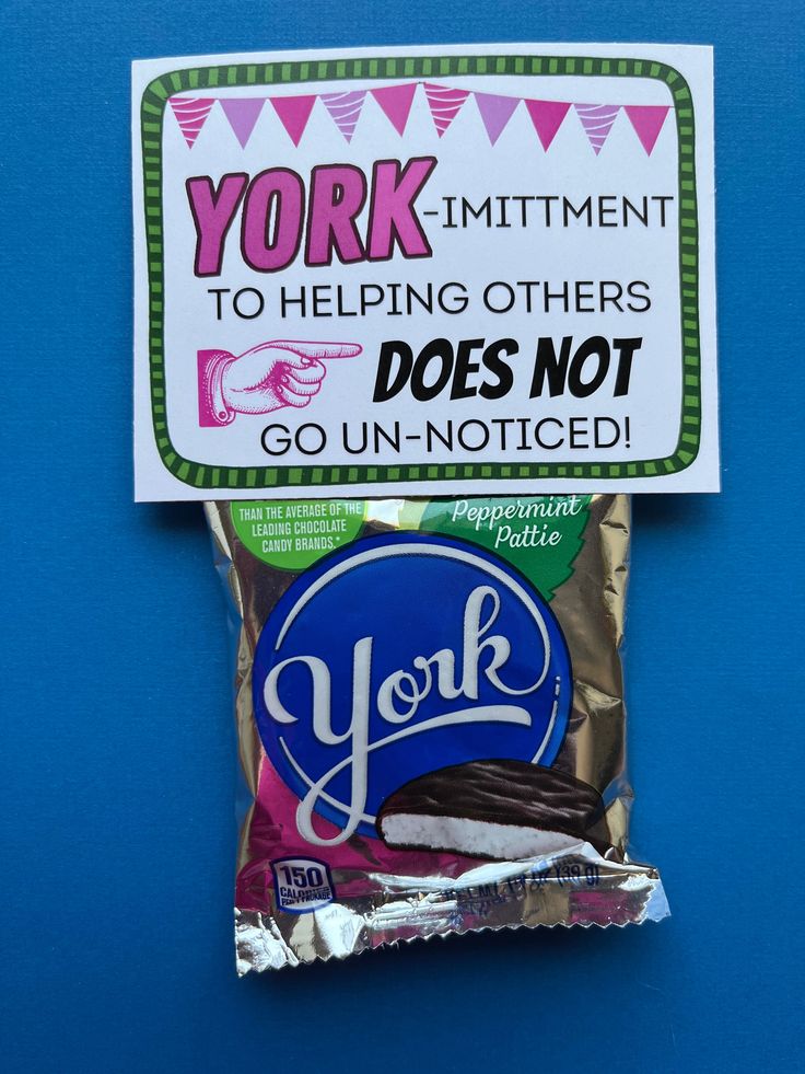 a bag of york mints sitting on top of a blue surface