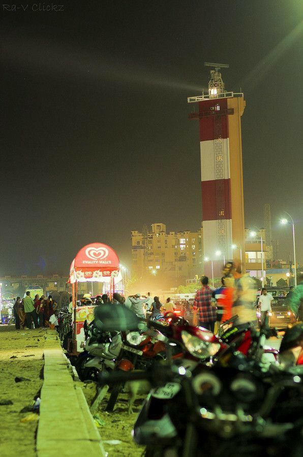 motorcycles are parked on the beach at night