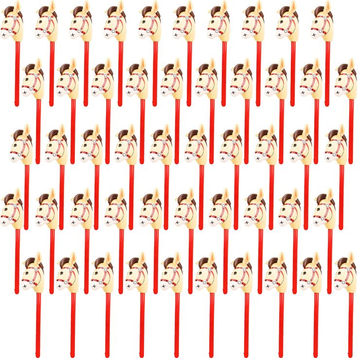 many red toothpicks with faces on them are lined up in the same pattern