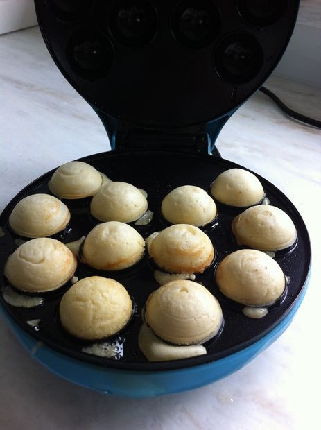 the buns are being cooked in an air fryer on the counter top, ready to be eaten