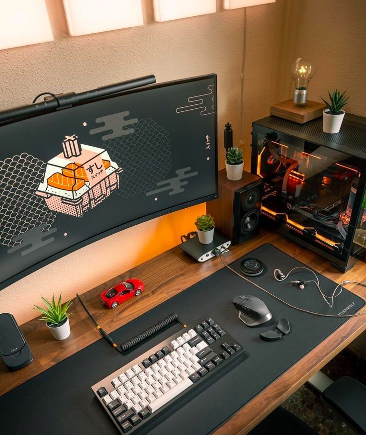 a desk with a computer monitor, keyboard and mouse on it next to a potted plant