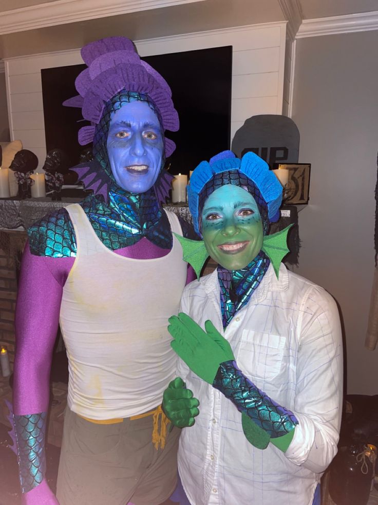 two people dressed in costumes standing next to each other