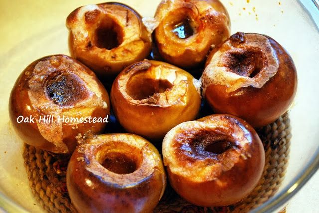 a glass bowl filled with donuts sitting on top of a table