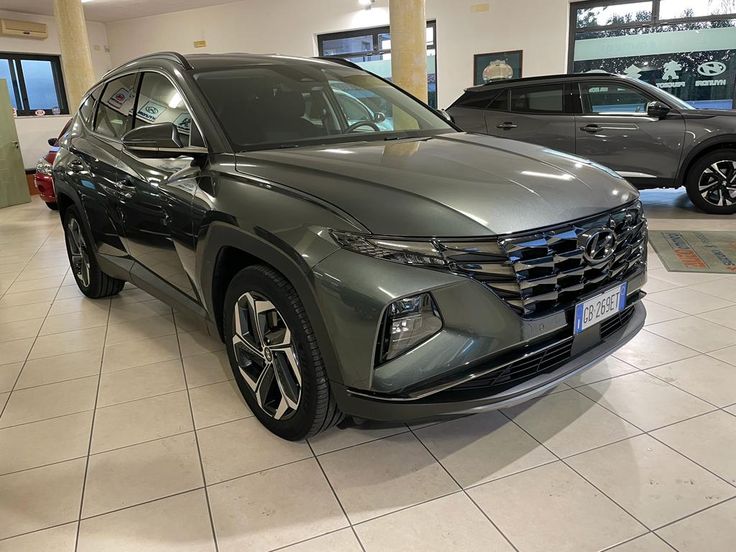 a grey car is parked in a showroom