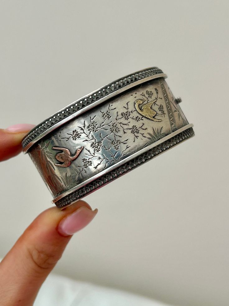 Antique Wide Aesthetic Silver Bangle Cuff Bracelet with Gold Overlay Birds  amazing chunky detailed bangle!  The item comes without the box in the photos but will be presented in a gembank1973 gift box   Measurements: Weight 39.34g, Inner Diameter 45mm x 40mm, width 30mm Materials: silver & gold overlay  Hallmarks: none present   Condition : The overall condition is very good office use: D22 Chunky Bangles, Gold Overlay, Jewelry Fashion Trends, Funky Jewelry, Silver Bangle, Silver Bangles, Arm Band, Cuff Bracelet, Favorite Jewelry