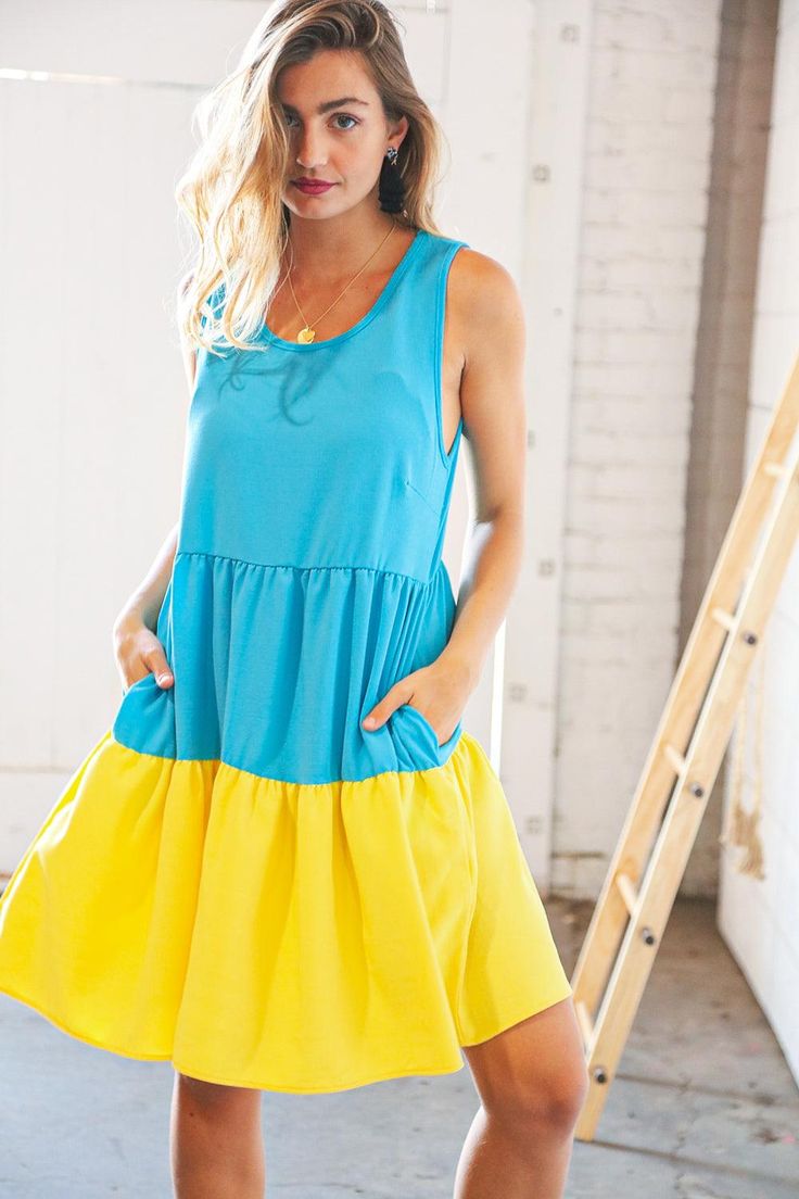 This Scuba Blue Yellow Color Block Tiered Tank Dress is the perfect pick-me-up for when you're feeling a little blah. With bright, cheerful colors and two side pockets, it's your go-to dress when you want to feel fantastic and add some oomph to your look. Feel the sass and show what you got! Material: 100% Polyester Stretch: No Stretch Runs Large Imported Product Measurements Bust (side to side seam): S 19" M 20" L 21" 1X 23" 2X 24" 3X 25" Length (shoulder to hem): S 35" M 36" Large 37" 1X 38" 2 Yellow Color Block, Denim Short Jumpsuit, Denim Short Dresses, Sandals Flats, Romper Dress, Woven Dress, Crepe Fabric, Blue And Yellow, Tiered Dress