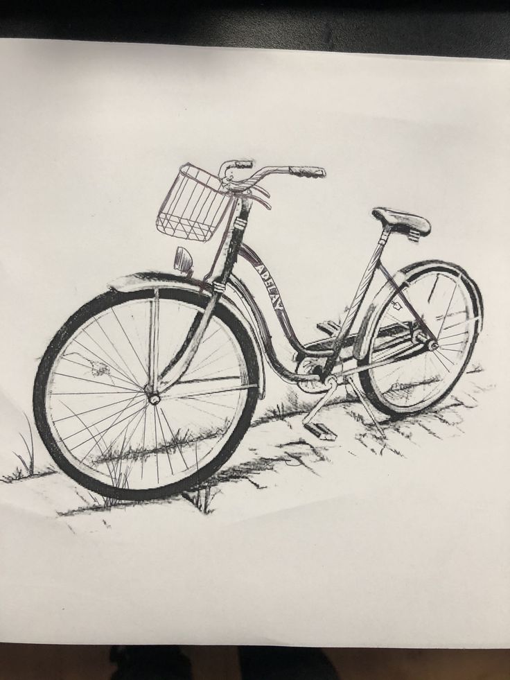 a drawing of a bicycle parked in the grass