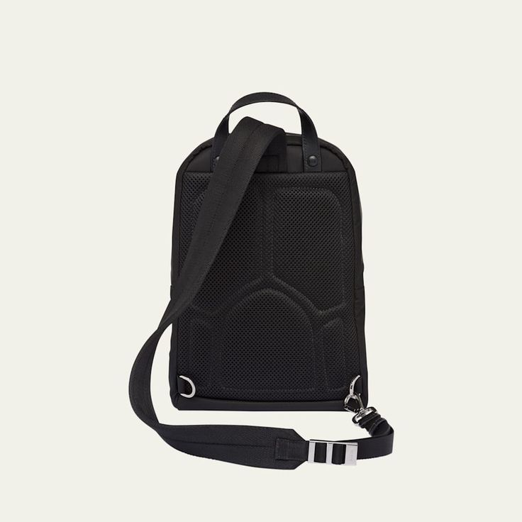 Prada backpack in nylon featuring the signature enameled triangle logo Top carry handle Adjustable shoulder strap Two-way zip closure Exterior, two zip pockets Interior, one zip pocket, one slip pocket Recycled nylon lining Polyfill padded back panel Approx. 12.2"H x 7.9"W x 2.0"D Made in Italy Modern Nylon Chest Bag With Zipper Pocket, Nylon Standard Backpack For Business, Modern Nylon Leather Backpack With Zipper, Luxury Nylon Backpack For Daily Use, Designer Nylon Backpack For Everyday, Functional Nylon Chest Bag, Designer Nylon Backpack For Travel, Modern Nylon Leather Backpack With Zipper Closure, Luxury Nylon Backpack With Zipper Closure