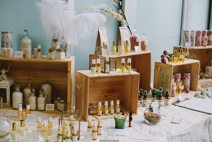 a table topped with lots of bottles filled with different types of oils and condiments