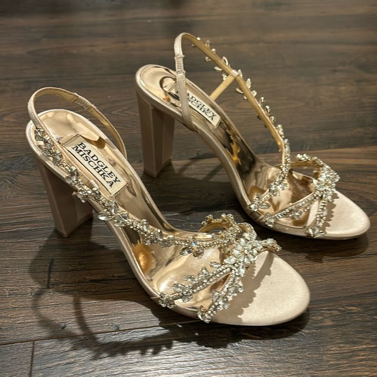 Badgley Mischka Felda Embelished High-Heel Sandal Champagne Satin Rhinestone And Crystal Embellished Straps Open Toe, Pull On Elastic Gore At Heel For A Flexible Fit 3.5" Covered Heel Satin Upper, Leather Sole Champagne Quince Heels, Fairytale High Heels, Wedding Heels Chunky, Heels For Champagne Dress, Emerald Green And Gold Heels, Shoes For Women Party, Champagne Gold Shoes, Heels With Gold Dress, Gold Prom Shoes Heels