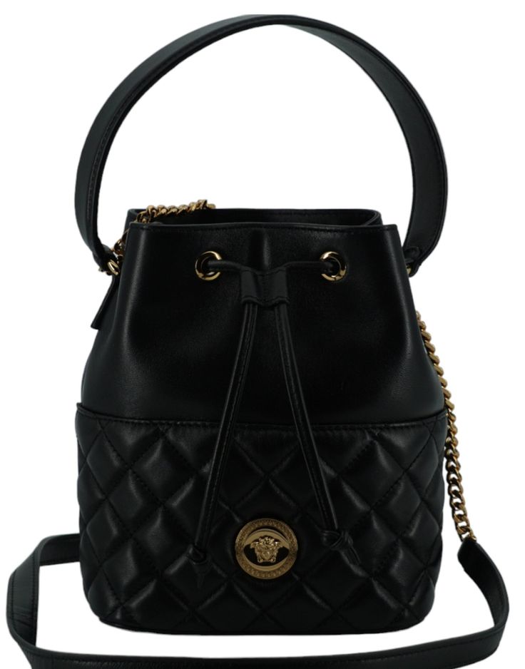 Indulge in the epitome of luxury with this stunning Versace Small Bucket Shoulder Bag, perfect for elevating any outfit. Crafted from sumptuous lamb leather and adorned with the iconic Medusa head logo, this bag is a symbol of style and elegance. Designed for versatility, it features a detachable chain and leather strap, allowing you to wear it elegantly on your shoulder or as a chic crossbody. Accented with gold-tone hardware, this bag seamlessly blends functionality with high fashion, making it a must-have accessory for your curated collection. Color: Black Material: Lamb Leather Country of origin: IT Top Handle: 35cm leather top handle Strap: 110cm removable chain and leather shoulder strap Measurements: L*H*W: 24cm*20cm*9cm Small Buckets, Medusa Head, Versace Bags, Leather Bucket Bag, Leather Bucket, Quilted Leather, Leather Accessories, Leather Top, Satchel Bags