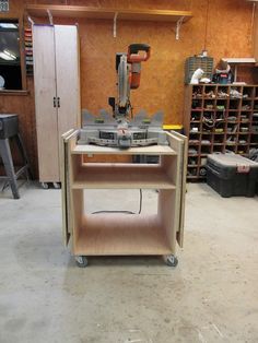 a workbench in a garage with tools on the table and shelves behind it