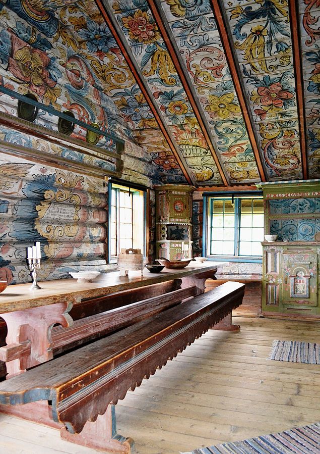 an old church with painted ceilings and wooden pews