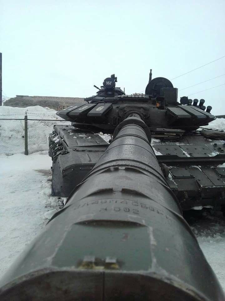 tanks are lined up next to each other in the snow