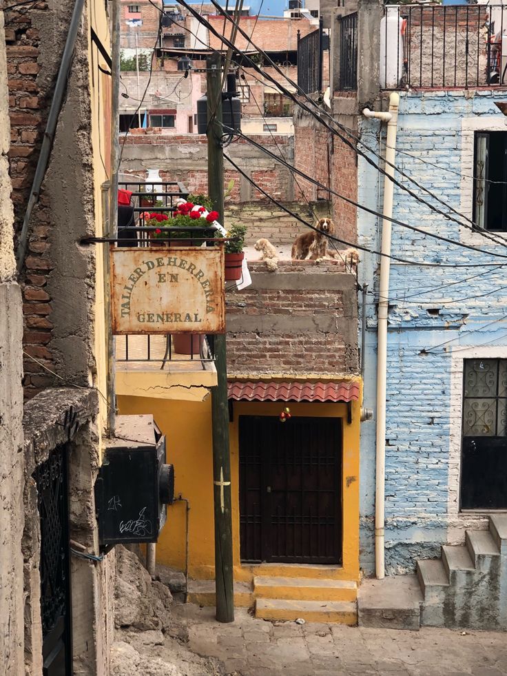 an alleyway in the city with old buildings