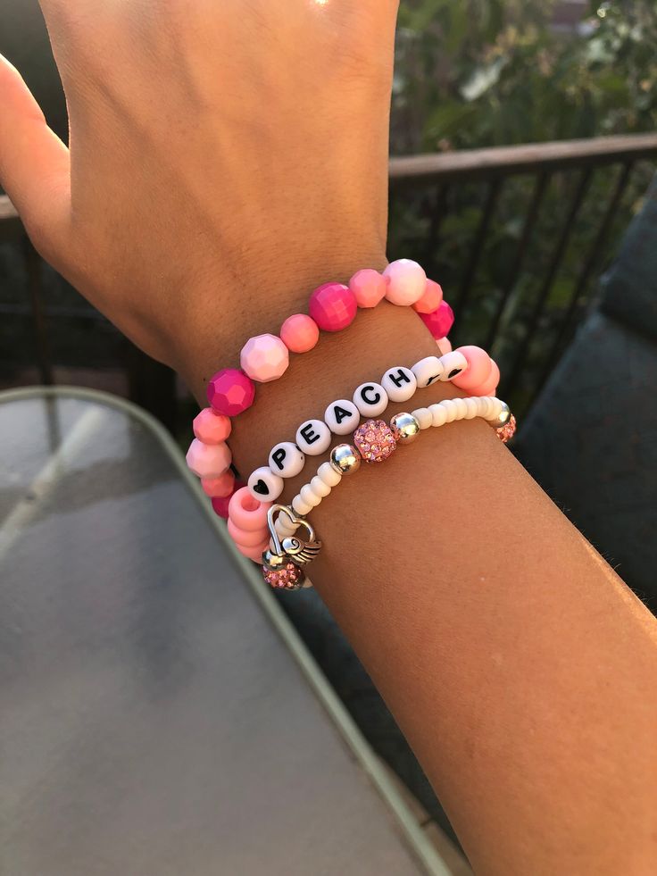 cute and trendy peachy bracelet set. Trendy Pink Beaded Charm Bracelet, Trendy Pink Charm Bracelet With Letter Beads, Trendy Everyday Wrap Bracelet With Round Beads, Trendy Wrap Bangle Bracelet For Friendship, Cute Pink Bangle Charm Bracelet, Trendy Beaded Bracelets With Letter Beads, Trendy Beaded Wrap Bracelet, Trendy Personalized Charm Bracelet, Casual Pink Beaded Charm Bracelet