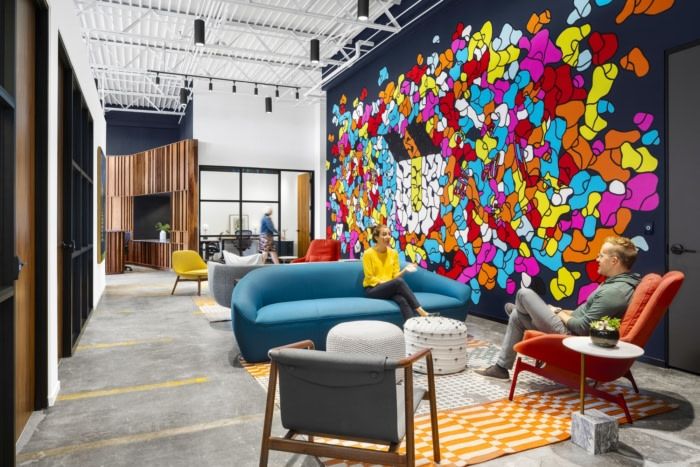 an office lobby with colorful artwork on the wall