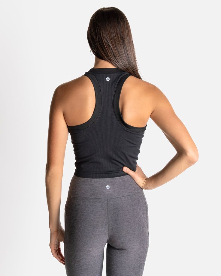 If you love our Bella Ribbed Tank, then say hello to the CROPPED Bella Ribbed Tank. Just a little extra crop for those who like a shorter length in their tank. This fabric has lots of stretch, so it will never chafe and will always keep you feeling cool, confident, and comfortable. With a racerback cut, no cups or removable shelf bra—so you can wear this tank over any workout bra you choose—it’s also incredibly versatile in a variety of activities. Fitted Racerback Crop Top With Built-in Bra, Functional Cropped Top With Built-in Bra, Black Crop Top Activewear With Built-in Bra, Black Activewear Crop Top With Built-in Bra, Black Tank Crop Top With Built-in Bra, Black Stretch Tank Sports Bra, Functional Black Top With Built-in Bra, Black Tank Crop Top With Medium Support, Black Tank Crop Top For Yoga