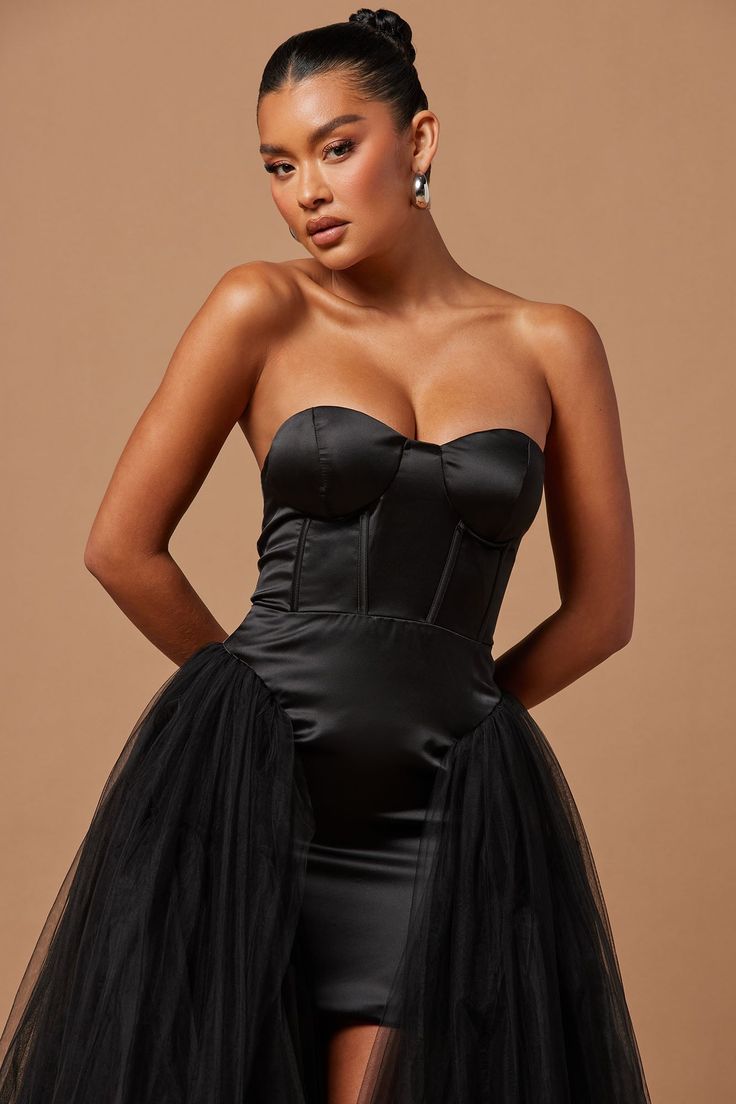 Available In Black And White. Corset Tulle Gown Tube Padded Bra Cups High Low Skirt Hidden Back Zipper Lined Partial Stretch Shell1: 100% Polyester Shell2: 100% Nylon Lining1: 95% Polyester 5% Spandex Lining2: 100% Polyester Imported | Zoee Corset Tulle Gown Dress in Black size XL by Fashion Nova Fitted Black Gown With Tulle Skirt, Black Fitted Gown With Tulle Skirt, Fitted Black Tulle Dress, Fitted Tulle Skirt Evening Dress, Fitted Tulle Cocktail Gown, Black Mini Length Corset Dress For Wedding, Fitted Black Dress With Tulle Skirt, Black Satin Gown With Sweetheart Neckline, Black Fitted Dress With Tulle Skirt