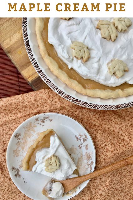 a pie with whipped cream on top and a wooden spoon in the bowl next to it