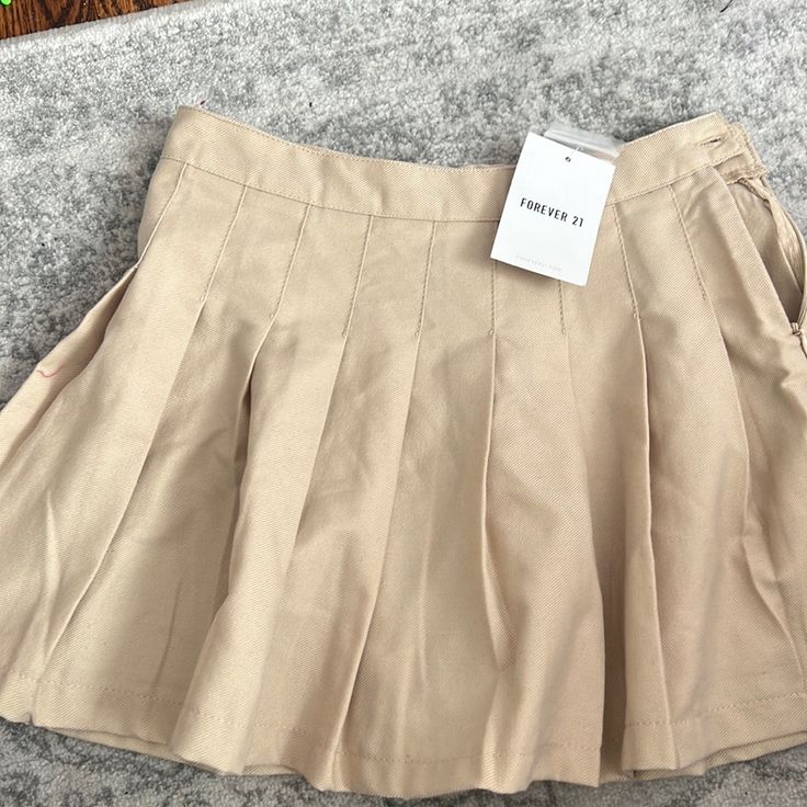 Brand New, Khaki Pleated Skirt. Size Is 9/10 But It Runs Small, I’d Say Fits Like A Size 8 Casual Flared Pleated Skirt For School, Casual Pleated Skirt For School, Casual Flared Pleated School Skirt, Casual School Pleated Flared Skirt, Casual Tennis Skirt For School In Summer, Trendy Flared Skirt For School, Trendy Flared School Skirt, School Mini Skirt With Lining, Trendy Pleated Skirt For School