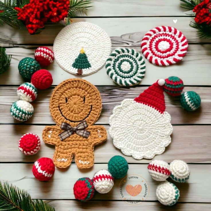 crocheted christmas ornaments are arranged on a table