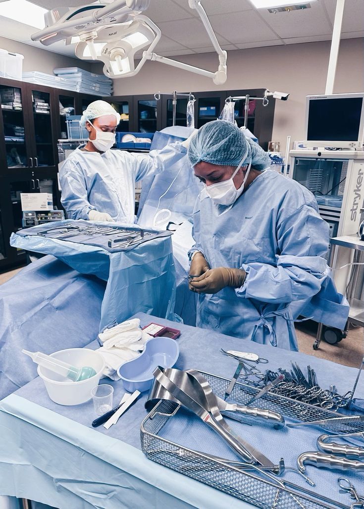 two surgeons are performing surgery in an operating room