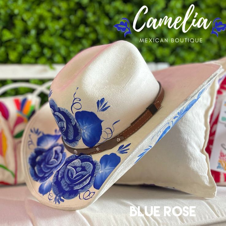 Hand Painted Cowboy Hat - Felt – Camelia Mexican Boutique Artistic Hand Painted Hat With Curved Brim, White Artisan Hand Painted Hats, Artistic Hat With Curved Brim As Gift, Artistic Curved Brim Hat As A Gift, Artistic Curved Brim Hat As Gift, Artistic Hand-painted Cap, Artistic Hand Painted Cap, Adjustable Hand Painted Blue Hat, Blue Bohemian Hat For Gift