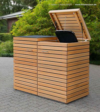 a large wooden box sitting on top of a sidewalk