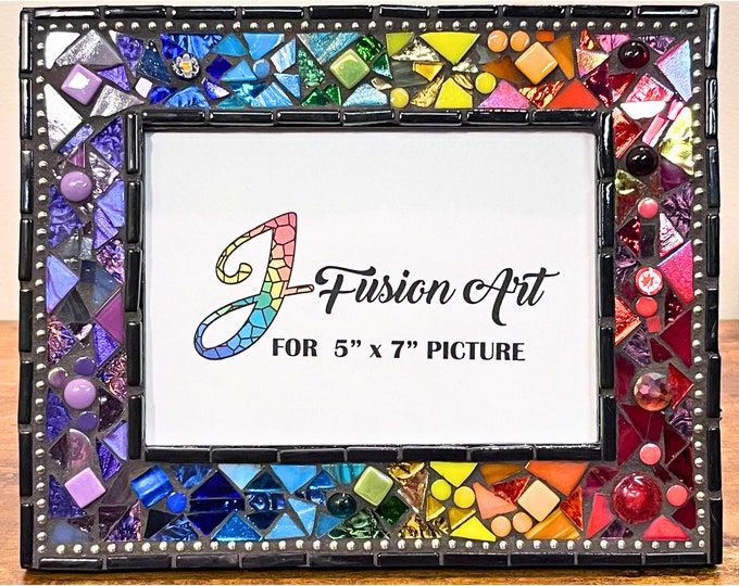 the frame is made out of multicolored glass and has a design on it