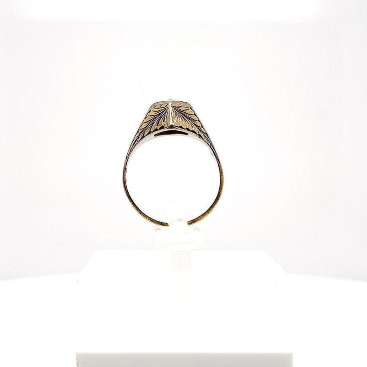 This is part of Chairish’s Fine Jewelry assortment.  A very fine antique engraved 14k gold and diamond ring.  With a lovely ca. 0.24 ct. Old European cut diamond (Color: G /Clarity: I1) set at the center of a hexagonal setting that is engraved with a feathered design to the band and shoulders.  Accompanied by a GEMLAB (Gemological Appraisal Laboratory) report.   Simply a wonderful ring!  Date: 20th Century  Overall Condition: It is in overall good, as-pictured, used estate condition with some ve Victorian 14k Gold Diamond Cut Rings, Antique Dome Ring Stamped 14k As Gift, Classic Engraved Ceremonial Signet Ring, Classic White Gold Initial Ring With Diamond Cut, Classic Engraved Signet Ring For Ceremonial Occasions, Formal Oval Engraved Ring With Intaglio, Classic Engraved Signet Ring For Ceremonial Use, Oval Engraved Ring With Intaglio For Formal Events, Formal Etched Gold Rings