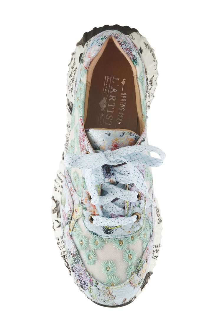 A flowery design makes sure you stand out in a hand-painted sneaker grounded by a sporty sole covered in a newspaper print. This statement-making kick is fitted with a cushy, arch-supporting footbed for endless comfort. 1 1/2" heel Cushioned footbed with arch support Synthetic upper/textile lining/rubber sole Imported Shoes 6 1/2, Embroided Shoes, Handpainted Shoes, 2023 Shoe Trends, Shoes Embroidery, Embroidered Sneakers, Coquette Sneakers, Fashion Sneakers, Dressy Sneakers