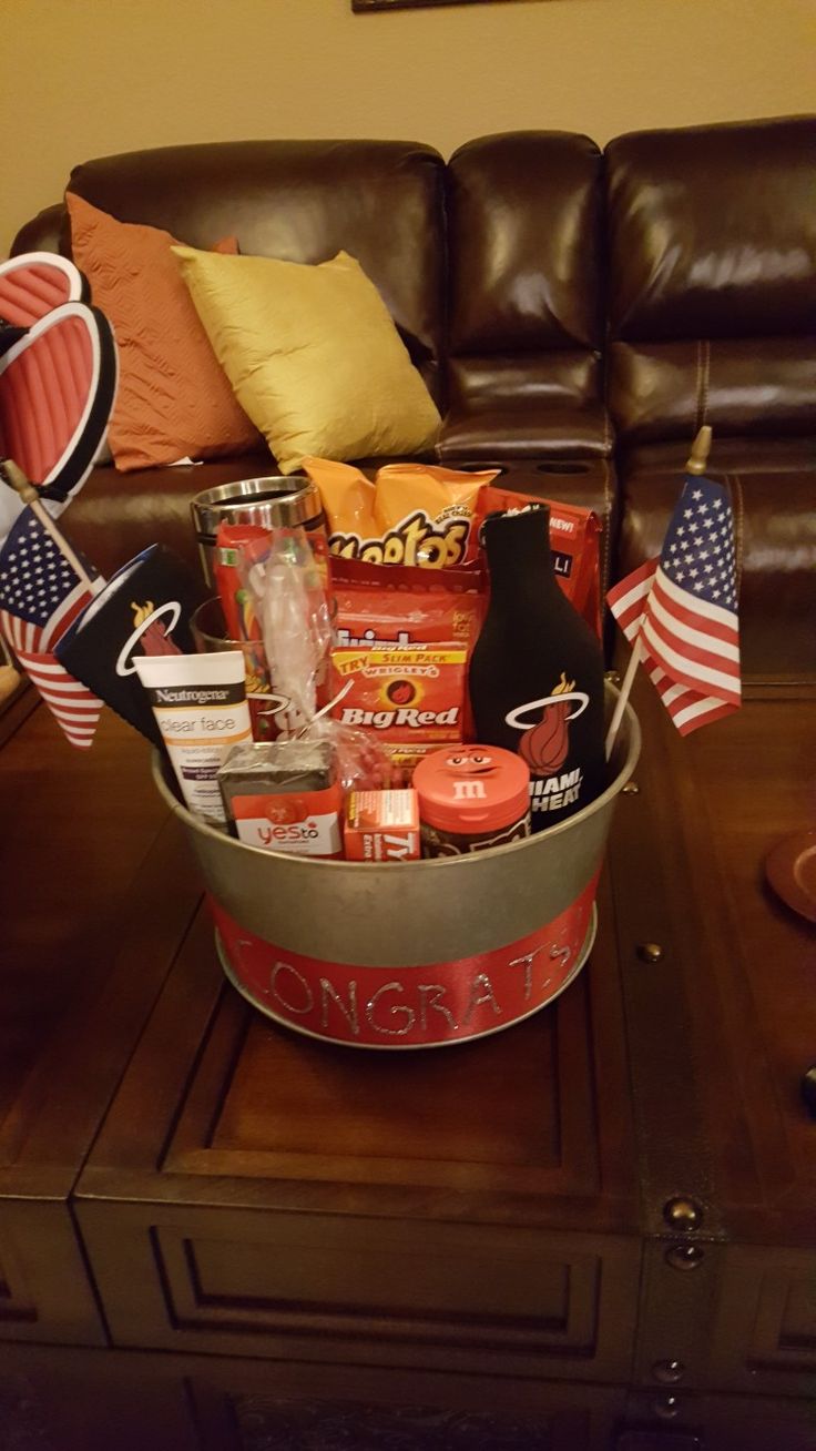 a living room filled with furniture and an american flag on top of a coffee table