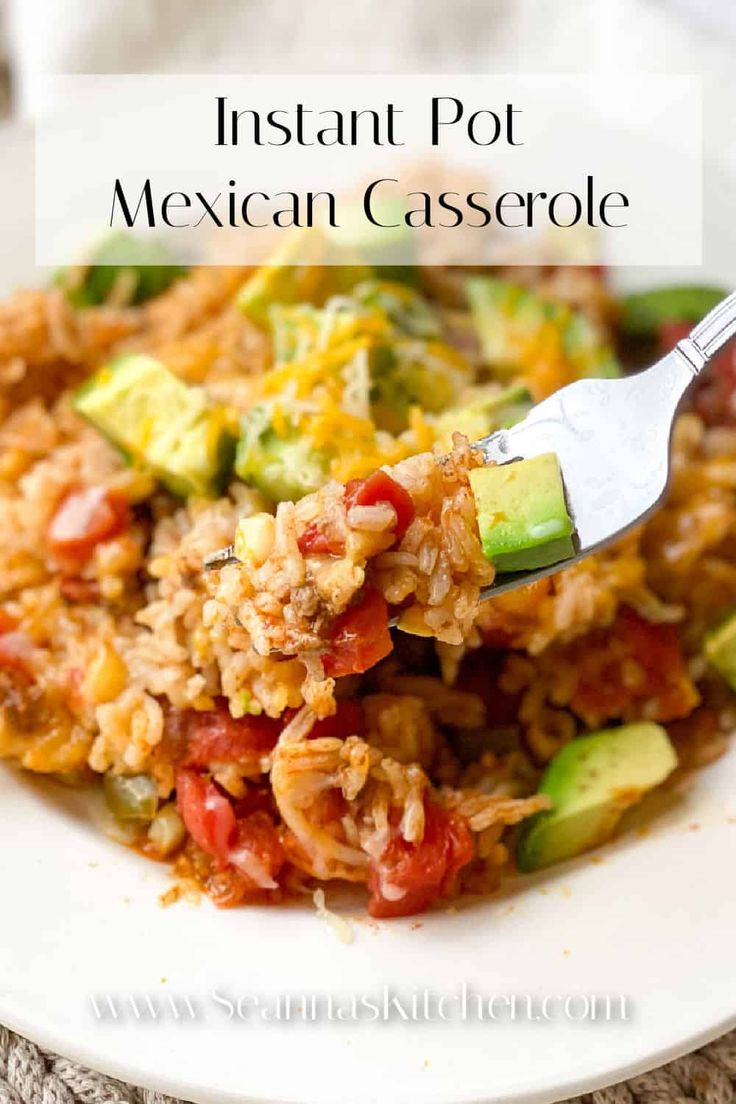 a white plate topped with mexican casserole covered in rice and veggies