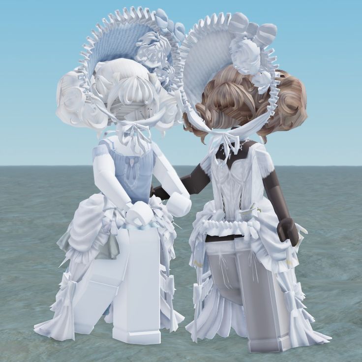 two dolls are standing in the water with their hands on each other's hips