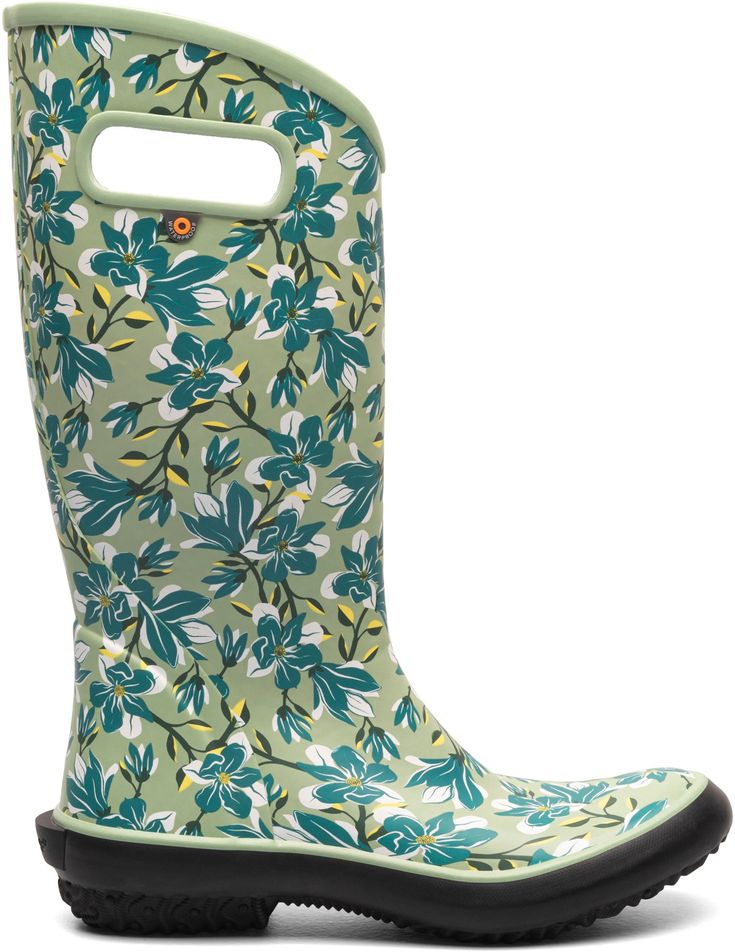 a pair of green and white boots with blue flowers on the soles, side view