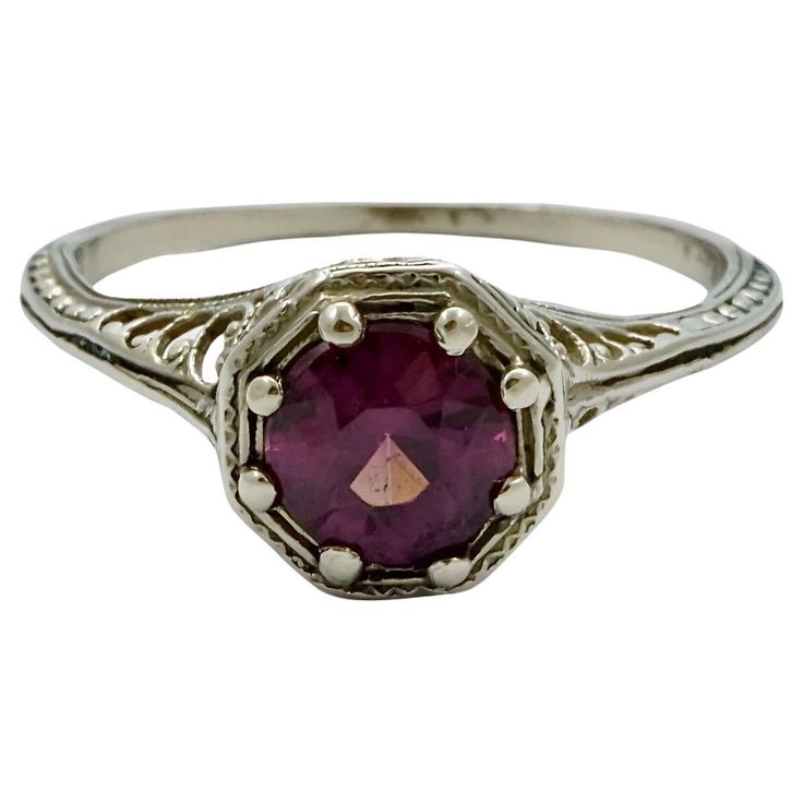 Art Deco 14K white gold dress ring with a faceted amethyst in an ornate filigree setting. Ring size UK M / US 6, inside diameter 1.75 cm / .68 inch, and the setting depth is 5.5 mm / .2 inch. The ring is in very good condition. This is a beautiful and stylish white gold and amethyst ring, circa 1930s. A classic from the Art Deco era. Amethyst Filigree Ring, Art Deco Hallmarked Amethyst Ring Gift, Art Deco Amethyst Hallmarked Rings, Antique Amethyst Ring With Filigree, Purple Art Deco Collectible Rings, White Gold Dress, Dress Ring, Dress Rings, Art Deco Era