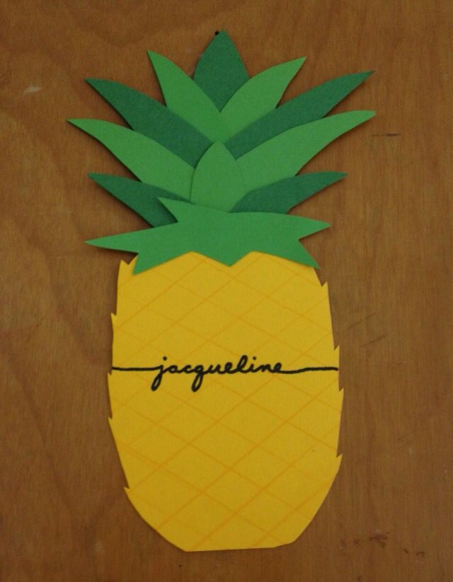 a pineapple cut out on top of a wooden table