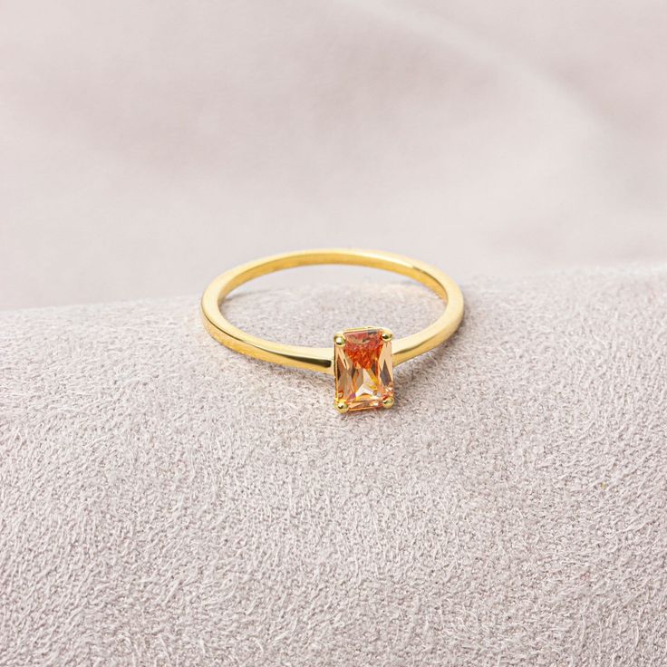 Citrine stone is believed to bring abundance, fertility and money for centuries. Our 14k solid gold and rectangular cut citrine ring is suitable for daily use with its special design and will be your indispensable jewel that you can use on your special days. A stylish jewel for you and your loved ones. Time to pamper yourself and your loved ones... Citrine is the birthstone for those born in November. 🤍🤍 Special gifts for your special moments. We produce our jewelry in the most perfect way for Elegant Citrine Birthstone Crystal Ring, Elegant Citrine Crystal Ring With Birthstone, Classic Gold Topaz Birthstone Ring, Gold Rings With Rectangular Gemstone, Elegant Citrine Solitaire Birthstone Ring, Gold Citrine Baguette Cut Ring, Elegant Amber Birthstone Ring, Gold Rectangular Crystal Ring, Rectangular Yellow Gold Topaz Ring