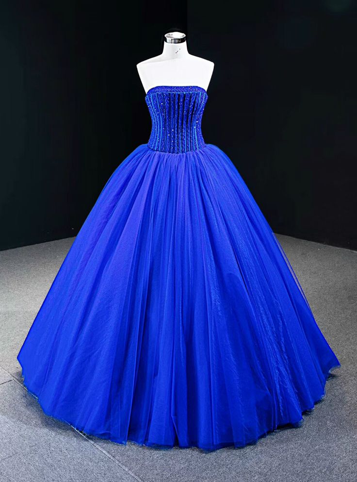 Bring distinction in your style by wearing this royal blue color ball gown dress. You are sure to find your way to his heart with this elite royal dress design. Exquisite strapless neckline with charming floor-length hemline is simply winning. Royal Dress Design, Royal Blue Ball Gown, Prom Dress Pattern, Tea Length Prom Dress, Blue Ball Gown, Tiered Prom Dress, High Neck Prom Dress, Pearl Wedding Dress, Black Ball Gown