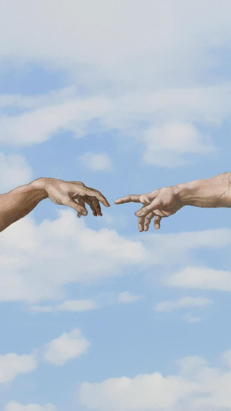 two hands reaching out towards each other in front of a blue sky with white clouds