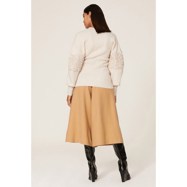 Off-white knit (64% Wool, 26% Polyamide, 9% Cashmere, 1% Elastane). Sweater. Mock neck. Long sleeves. Pull on. 24.5" from shoulder to hemline. Imported. White Feminine Knit Top For Fall, Feminine White Knit Top For Fall, White Knit Top For Work In Winter, White Long Sleeve Knit Top For Work, White Feminine Sweater For Fall, White Textured Knit Top For Workwear, White Textured Knit Top For Work, Cream Pointelle Knit Top For Fall, Elegant Spring Cable Knit Top