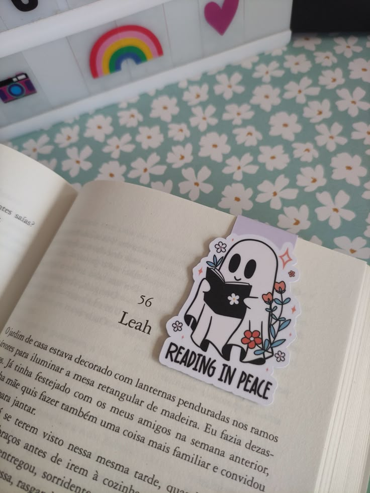 an open book with a sticker on the pages that says reading in peace,