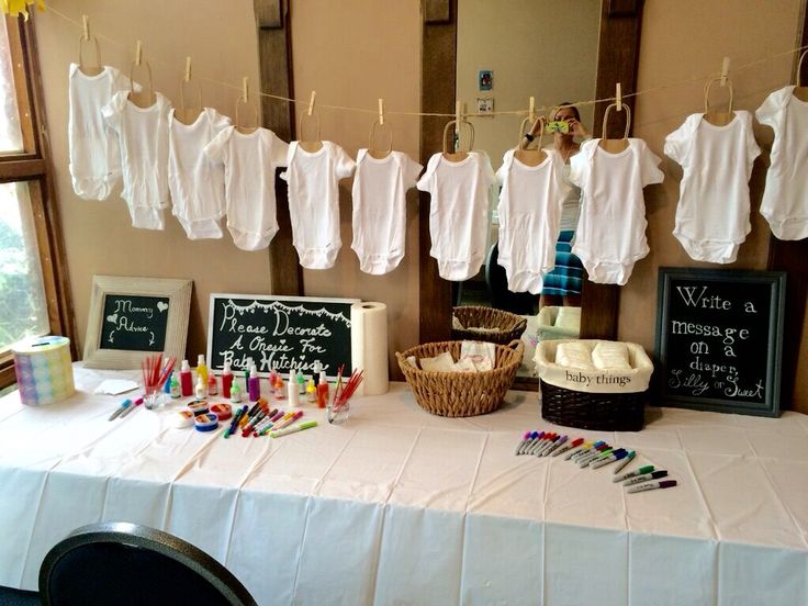 a table that has some clothes hanging on the line and other items in front of it