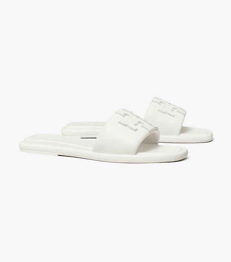 Classic Flat Slides With Removable Insole, Classic Leather Slides For Spring, Classic Spring Slides With Rubber Sole, Classic Slides With Leather Footbed For Spring, Classic Spring Slide Slides, Classic Flat Slides For Spring, Classic Leather Slides, Classic Slides With Textured Sole For Spring, Classic Spring Slides With Textured Sole