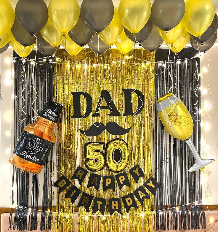 a 50th birthday decoration with balloons, confetti and decorations for the man's 50th birthday