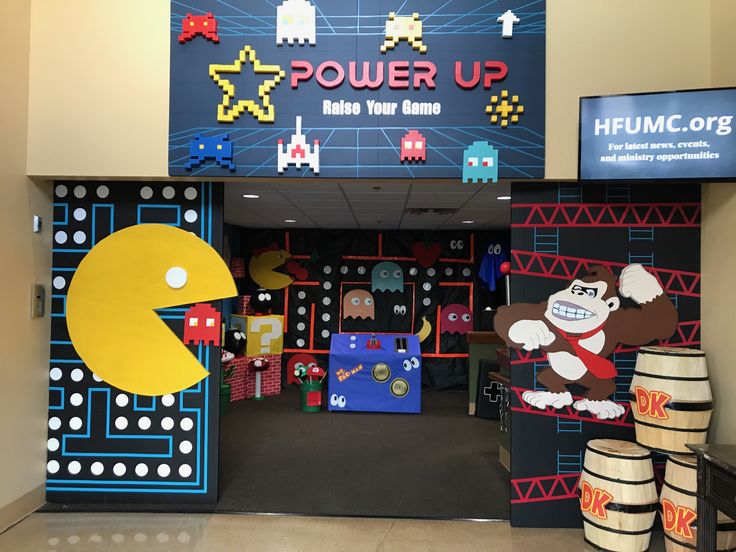 the entrance to an office building decorated with video game themed decorations and games on display