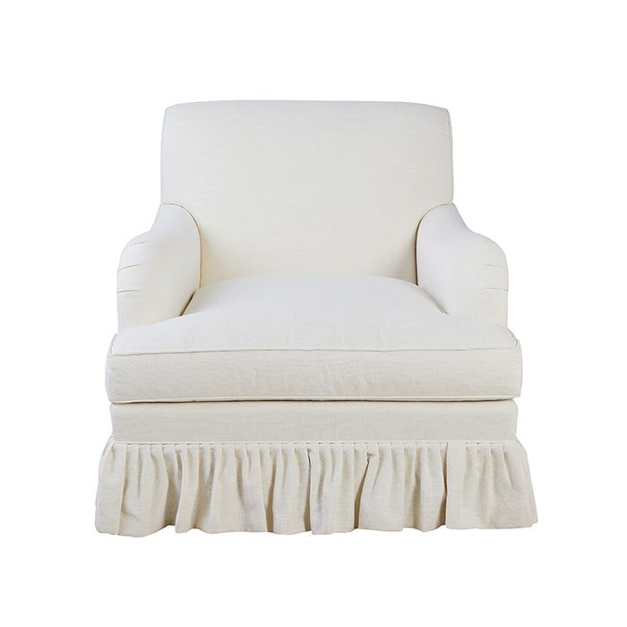 a white chair with a ruffled skirt on the bottom and back end, sitting in front of a white background