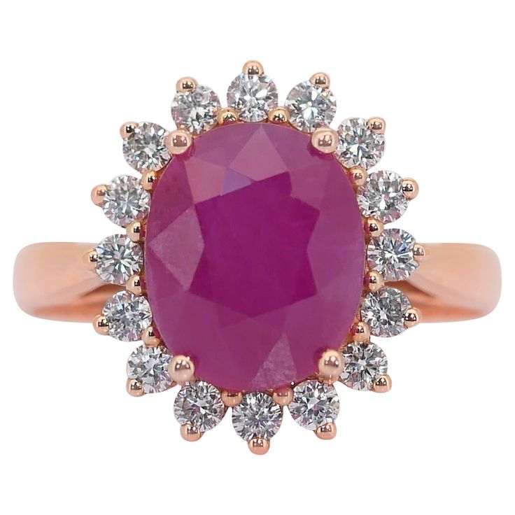 Fascinating 5.50ct Ruby and Diamonds Cluster Ring in 18k Rose Gold - IGI Certified This breathtaking 18k rose gold cluster ring showcases a stunning 4.87-carat oval-shaped ruby with a vibrant purplish-pink hue, radiating elegance and charm. Accentuating the ruby's beauty are 16 round diamonds, totaling 0.63-carat, for maximum brilliance. This IGI-certified masterpiece is a captivating blend of luxury and sophistication, perfect for adding a touch of opulence to any ensemble. Metal: 18k Rose Gold Main stone: 1 pc Ruby Main stone carat weight: 4.87ct Shape: Oval Color: Purplish Pink Side stone: 16 pcs Diamonds Side stone carat weight: 0.63ct Shape: Round Color grade: E-F Clarity grade: VVS-VS Cut grade: Very Good Total carat weight: 5.50ct Total jewelry weight: 4.70g Certificate Number: IGI Ruby Rose, Ruby Diamond, Diamond Cluster Ring, Diamond Cluster, Cluster Ring, 18k Rose Gold, Or Rose, Round Diamonds, Ruby