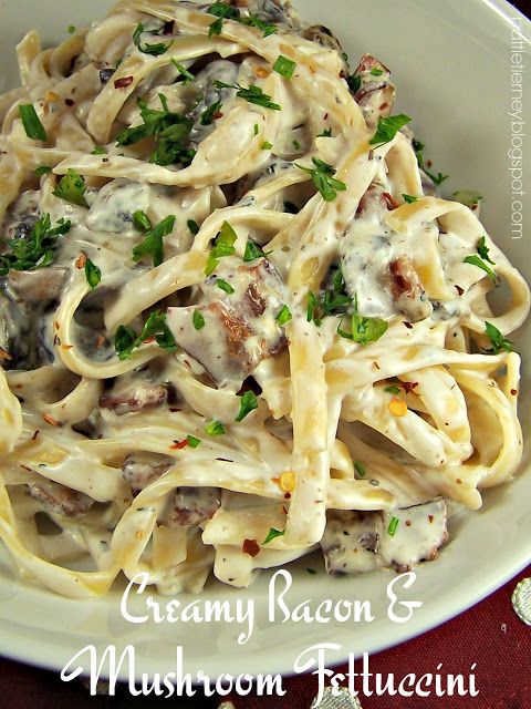 pasta with mushrooms and parsley in a white bowl on top of a red table cloth